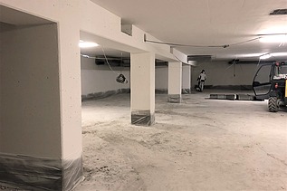 Instandsetzung der Tiefgarage  Foto von einer Tiefgarage und Instandsetzungsarbeiten